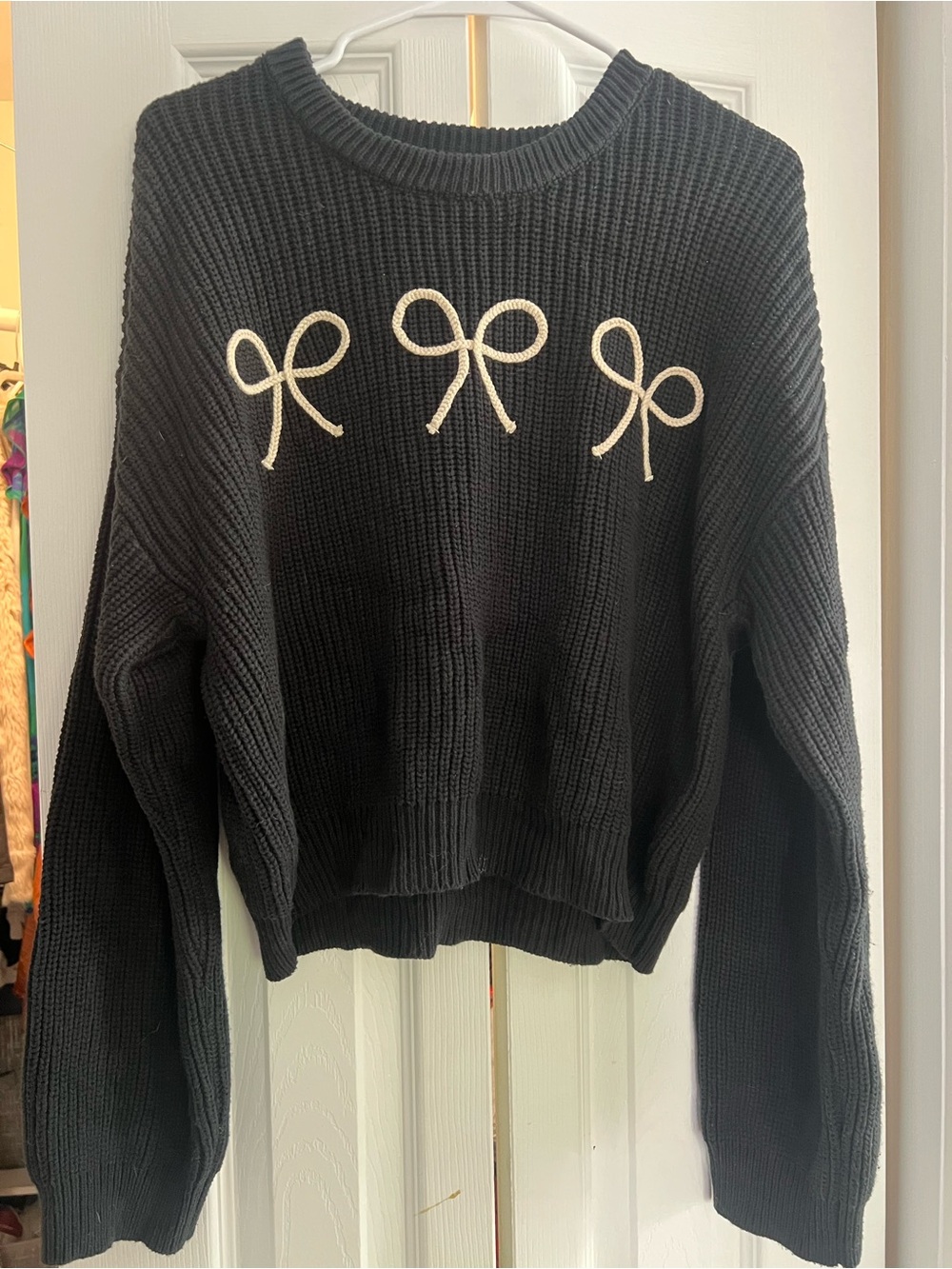 Black Crewneck Sweater with Cream Bow Appliqués